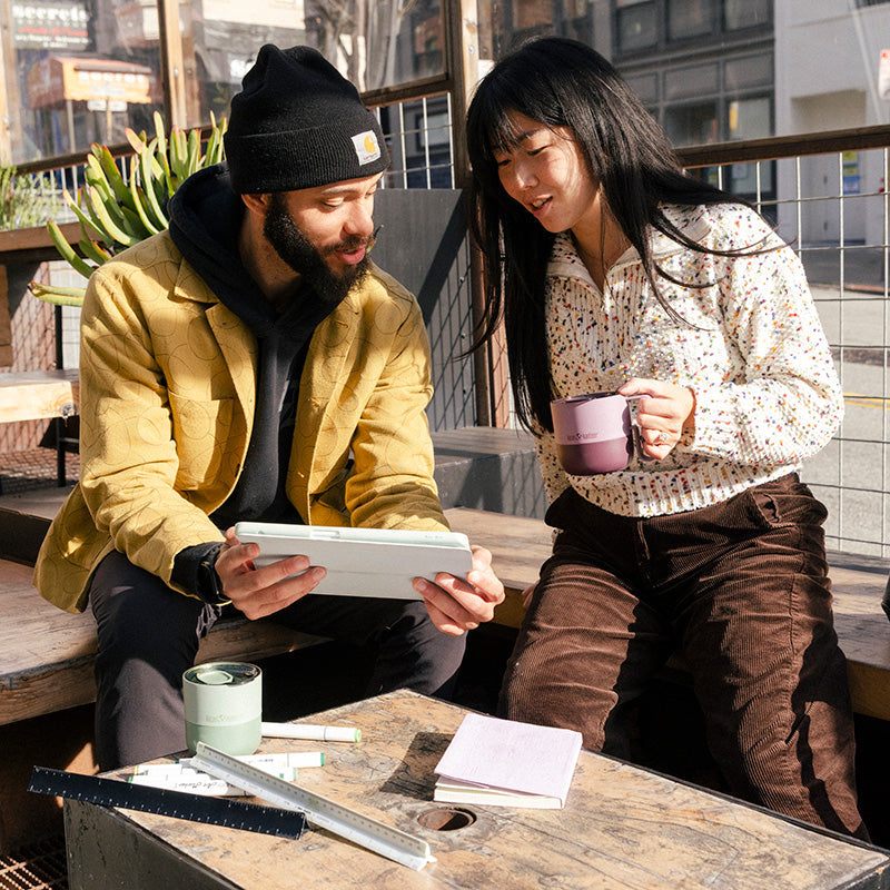 12oz-rise-mug-l3 12oz_rise_coffee_mug_dusty_orchid_couple_city_patio_square.jpg