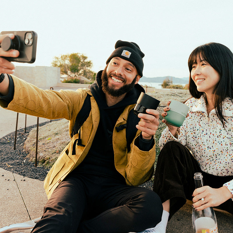 bring-your-own-party-kit-tumblers-and-cocktails-n2 8oz_rise_lowball_black_iceberg_couple_selfie_city_square.jpg