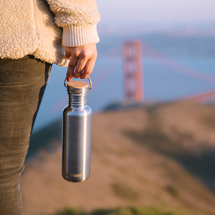 27oz-reflect-with-bamboo-cap-j5 K27SSLRF-BS-BAMBOO_reflect_bottle_bridge_lifestyle.jpg