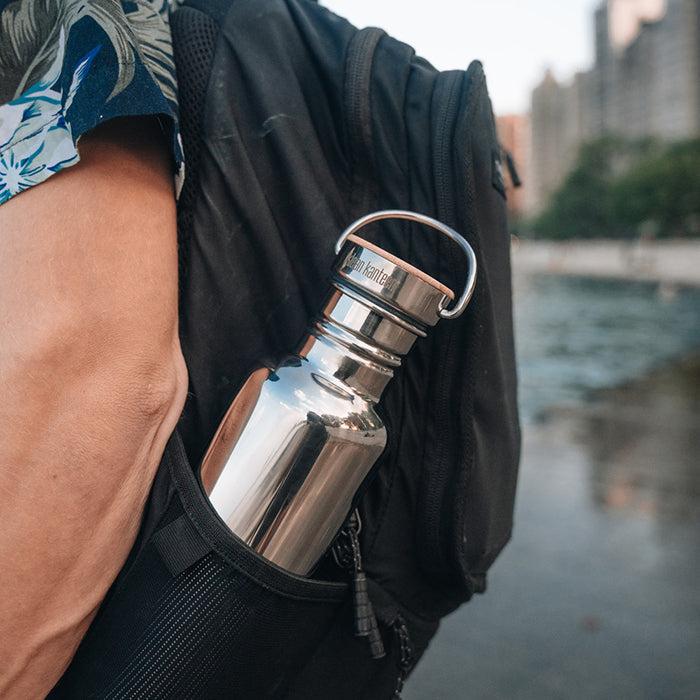 27oz-reflect-with-bamboo-cap-j5 K27SSLRF-MS-BAMBOO_reflect-bottle_backpack_lifestyle.jpg